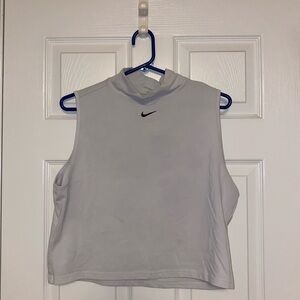 Nike activewear top, sleeveless, white, extra large in size.